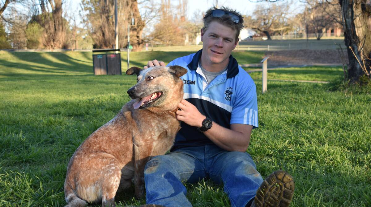 TRADING ROLES: Tumut five-eighth Jacob Toppin, with Red Heeler Fletch, is feeling more confident in the number six jumper ahead of Sunday's grand final.