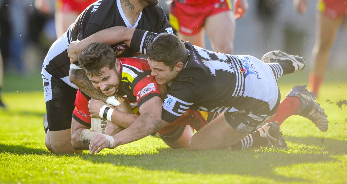 New Tumut recruit Kyle Danilczak, pictured tackling Dale Cooper-Shields, has made the move from Yass to play with the Blues. Picture by Sitthixay Ditthavong