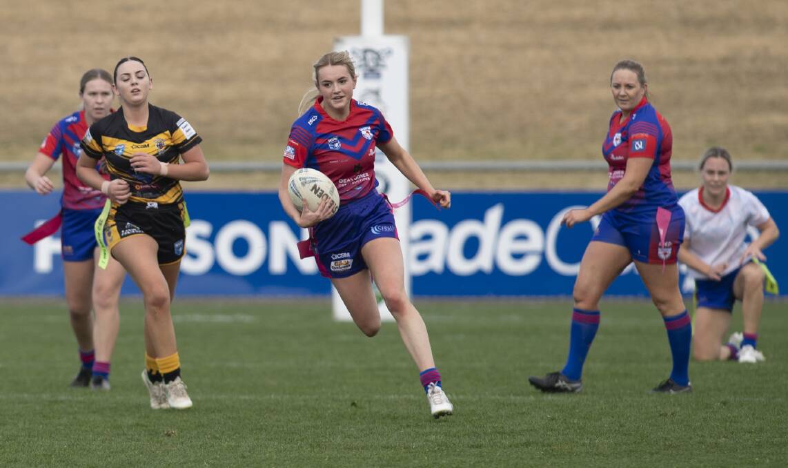 ON THE FLY: Lauren Jolliffe makes a break before going on to score one of her five tries as Kangaroos dominated Gundagai on Saturday. Picture: Madeline Begley