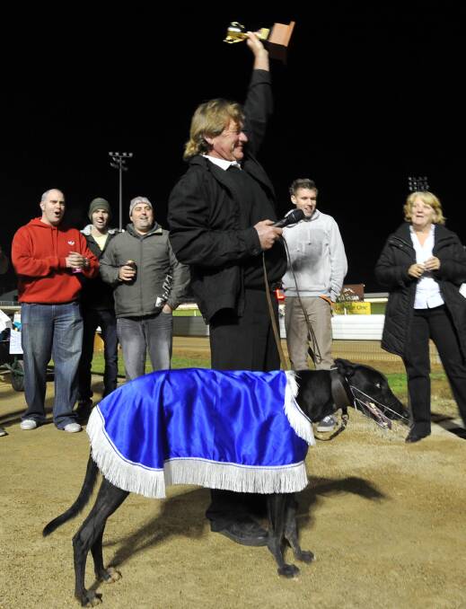 Brian Smith celebrates Wenzke's victory in the Wagga Gold Cup in 2012.