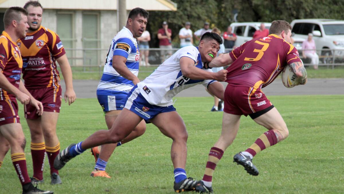 NEW FACE: Cootamundra recruit Romann Leota tries to make a tackle in the trial loss to Thirlmere on Saturday.