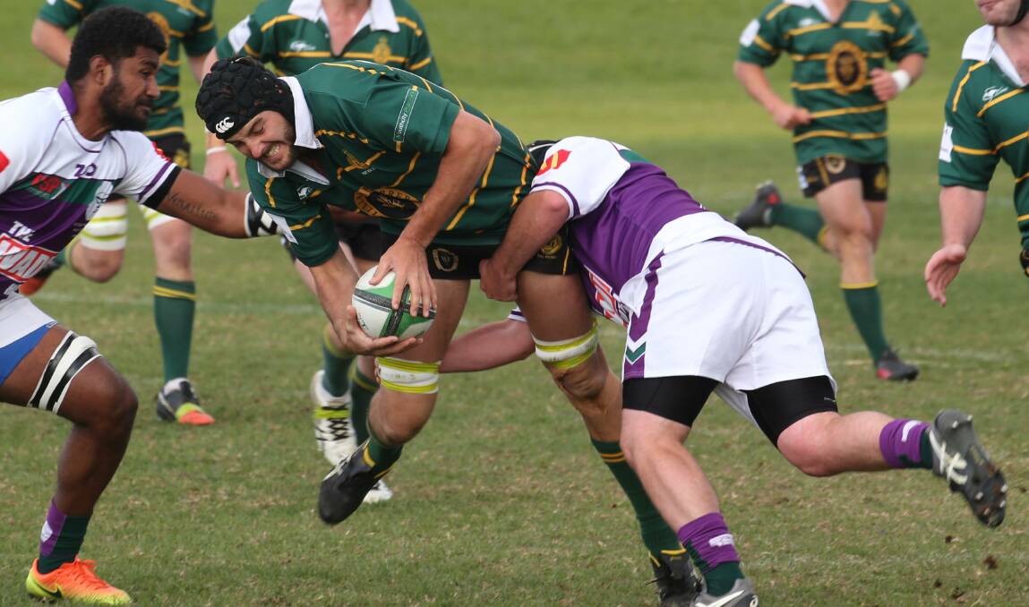 GOING DOWN: Ben Brooke gets caught by the Leeton defence in Ag College's loss on Saturday. Picture: Anthony Stipo
