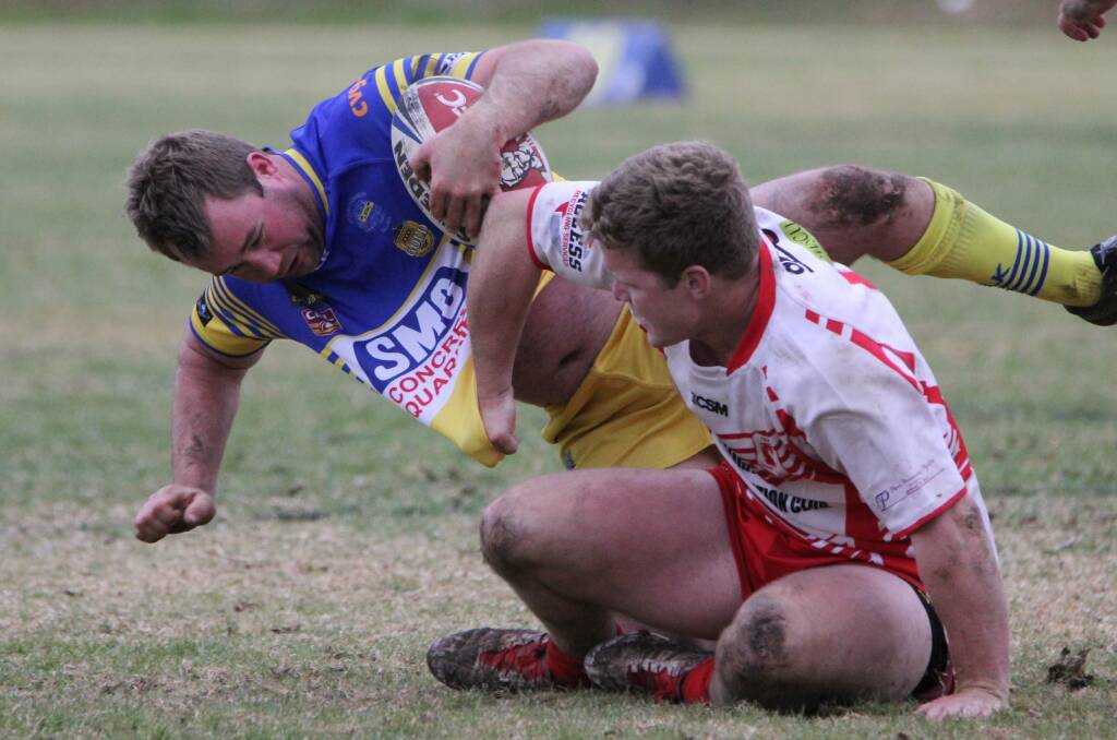 GOING DOWN: Temora prop Hayden Philp drags Mark Halliburton down in Junee's surprise loss at Laurie Daley Oval on Sunday. Picture: Liz Cowled