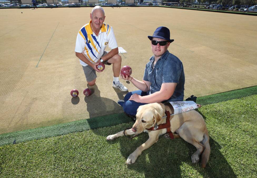 NEW TEAM: Joel Jensen has taken up blind lawn bowls thanks to support from Wagga RSL member Kevin Smith and faithful guidedog Nicci. Picture: Les Smith