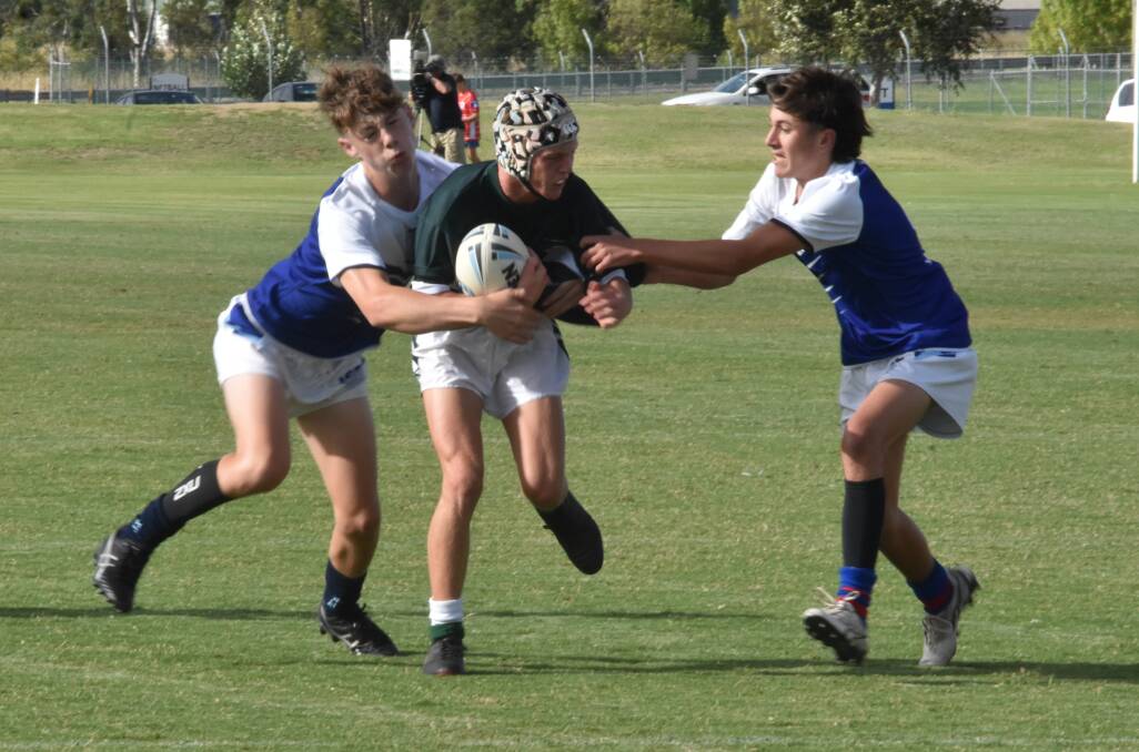 ALL SQUARE: Angus Beggs tries to break out of the Wagga High defence during The Riverina Anglican College's draw to start their Hardy Shield campaign on Wednesday. Picture: Courtney Rees
