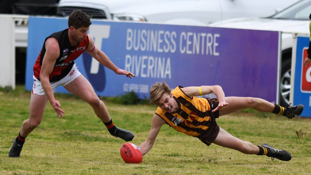 DESPERATION: Kyle Hockley looks to get to the ball before Callum Gardner in East Wagga-Kooringal's big loss to Marrar on Saturday.