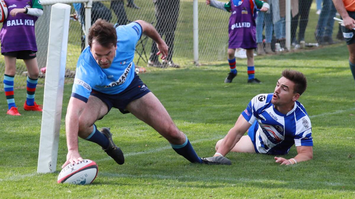 TRY TIME: James Grimmett plants the ball down for his second try to keep Waratahs in the hunt for the Southern Inland title. Picture: Les Smith