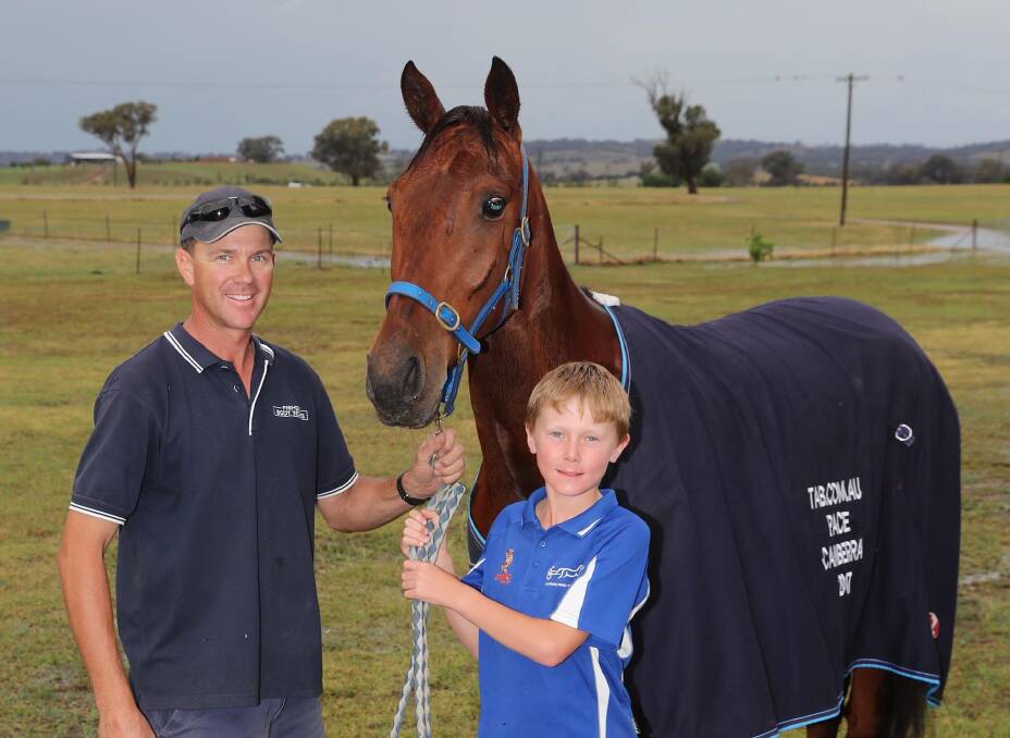 WINNING HOPE: Ross Arentz and 10-year-old son Oliver are hoping Zoes Regal can put in another good performance at Wagga on Friday in a HRNSW Rewards Series heat. Picture: Les Smith