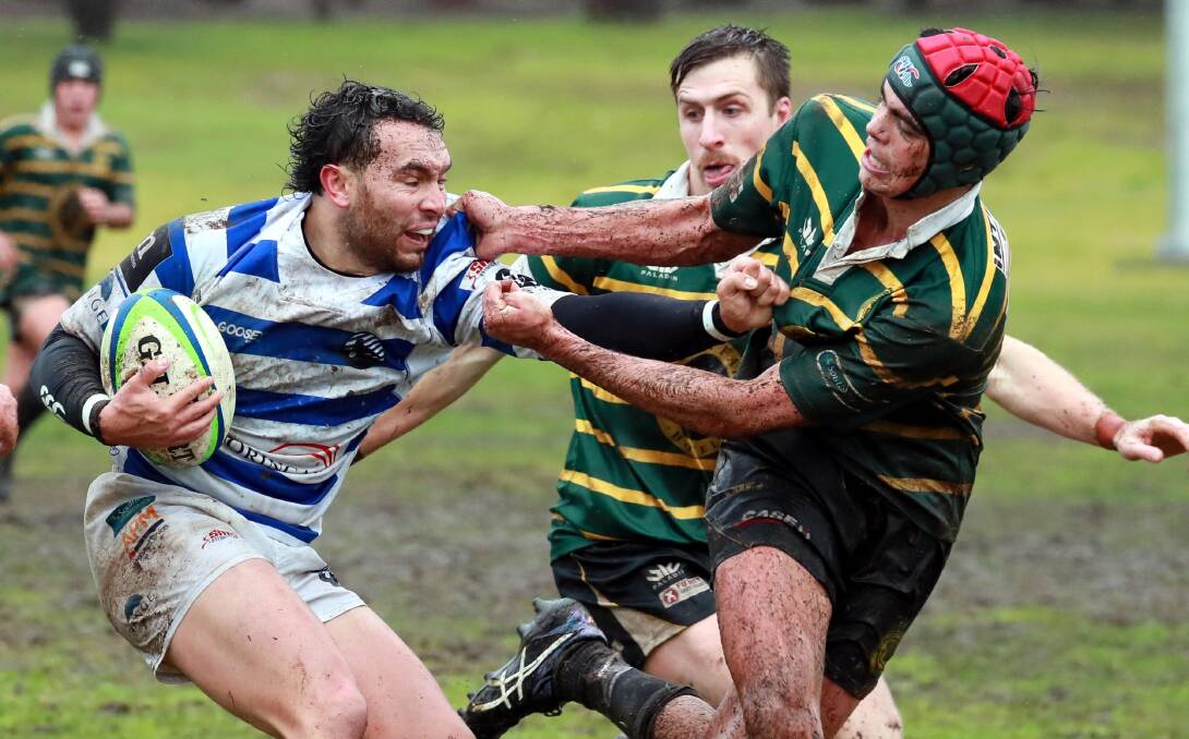 TOUGH SLOG: Dylan McLachlan tries to push off Charles Mitton as he made his return in Wagga City's 96-0 win over Ag College on Saturday. Picture: Les Smith