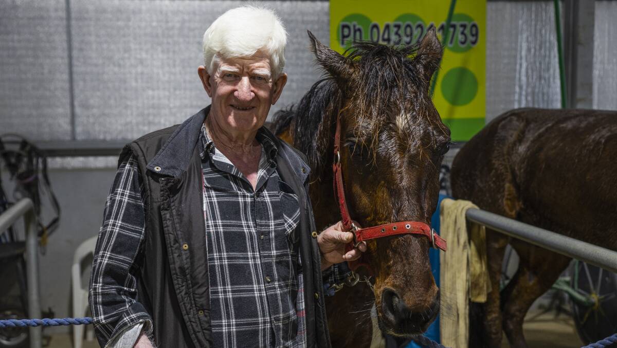 John Thompson with Rock The Tableau after their win after Riverina Paceway on Friday. It was the Leeton trainer's first in six years. Picture by Ash Smith