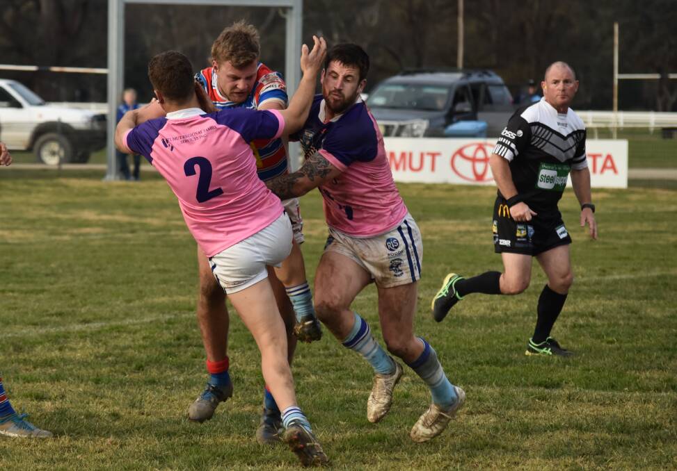 TIGHT TUSSLE: Nic Hall tries to push out of Malik Aitken's tackle attempt in Young's loss to Tumut at Twickenham on Saturday. Picture: Courtney Rees