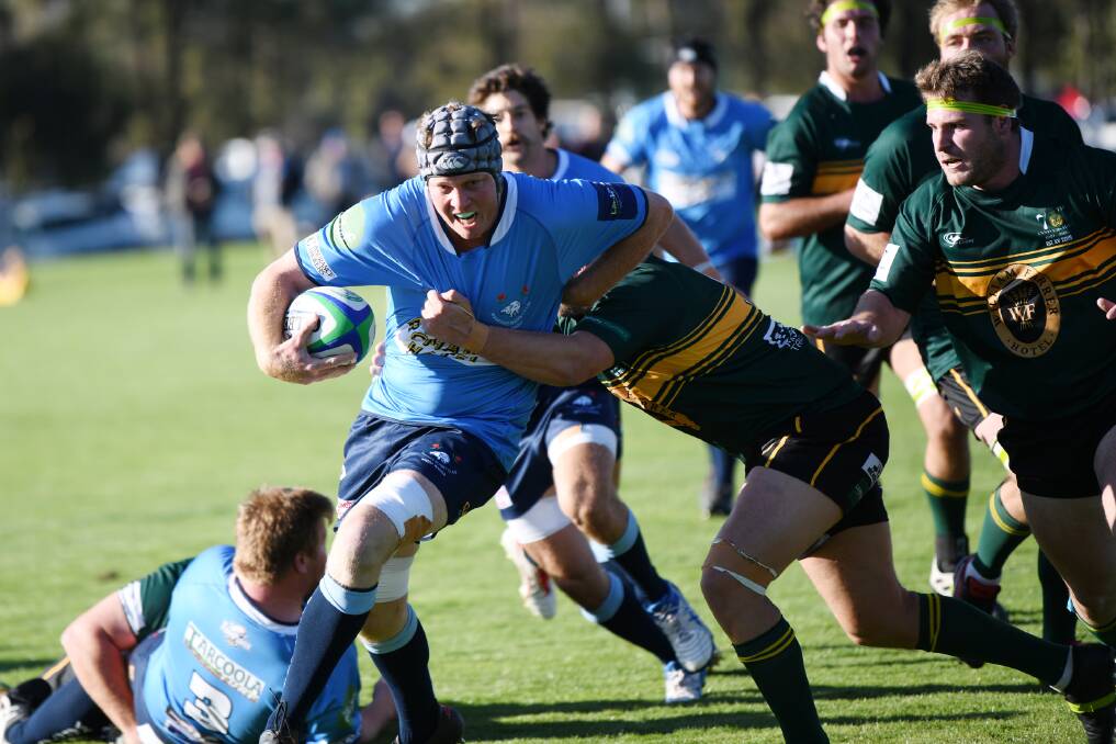 FORWARD MOMENTUM: Charlie Sykes brings the ball forward in Waratah's win in the grand final rematch against Ag College at Conolly Rugby Complex on Saturday.