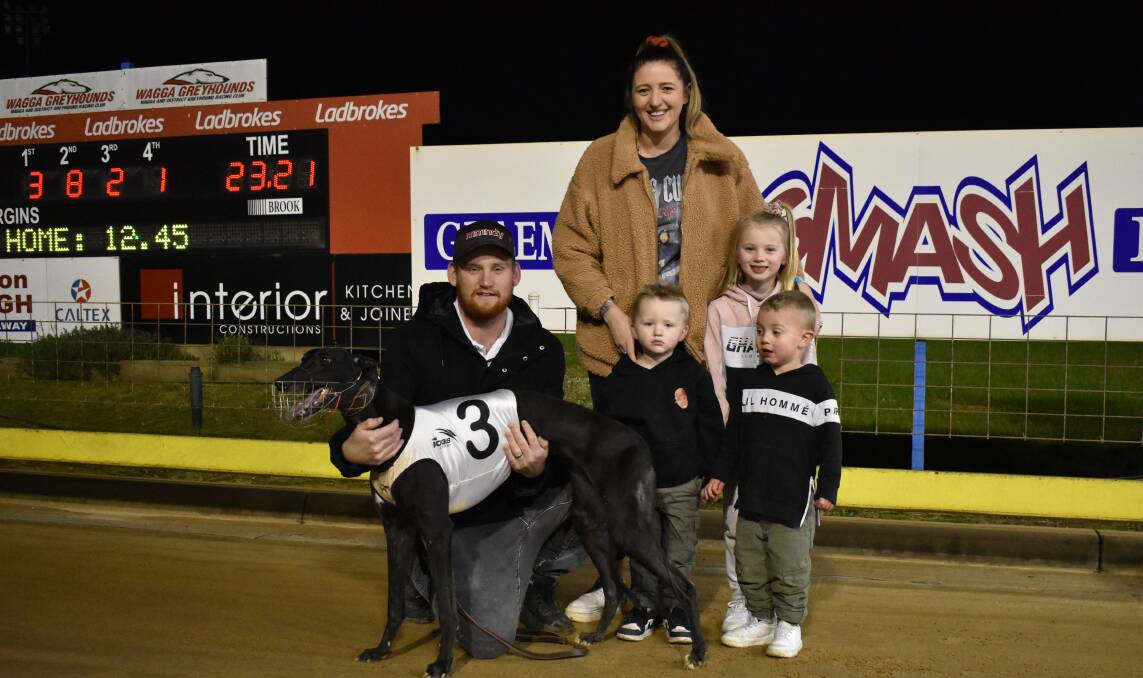 SWEET SUCCESS: Steve Kemp celebrates Finn Bop's feature win at Wagga on Friday night with wife Kristy their children Roy, 3 and Dakota, 6, and their friend Oben Huthwaite, 3. Picture: Courtney Rees