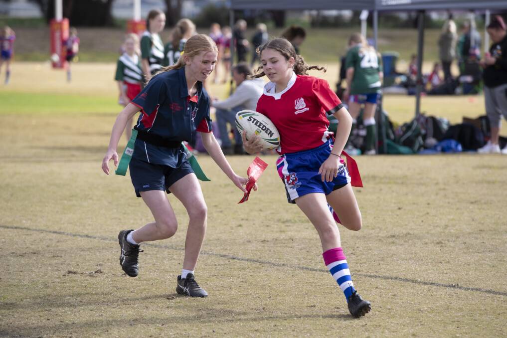 GOT YA: Abbey Hunt tags Amelia Morris in the Mortimer Shield clash between Mount Austin and Mater Dei at Parramore Park on Friday. Picture: Madeline Begley