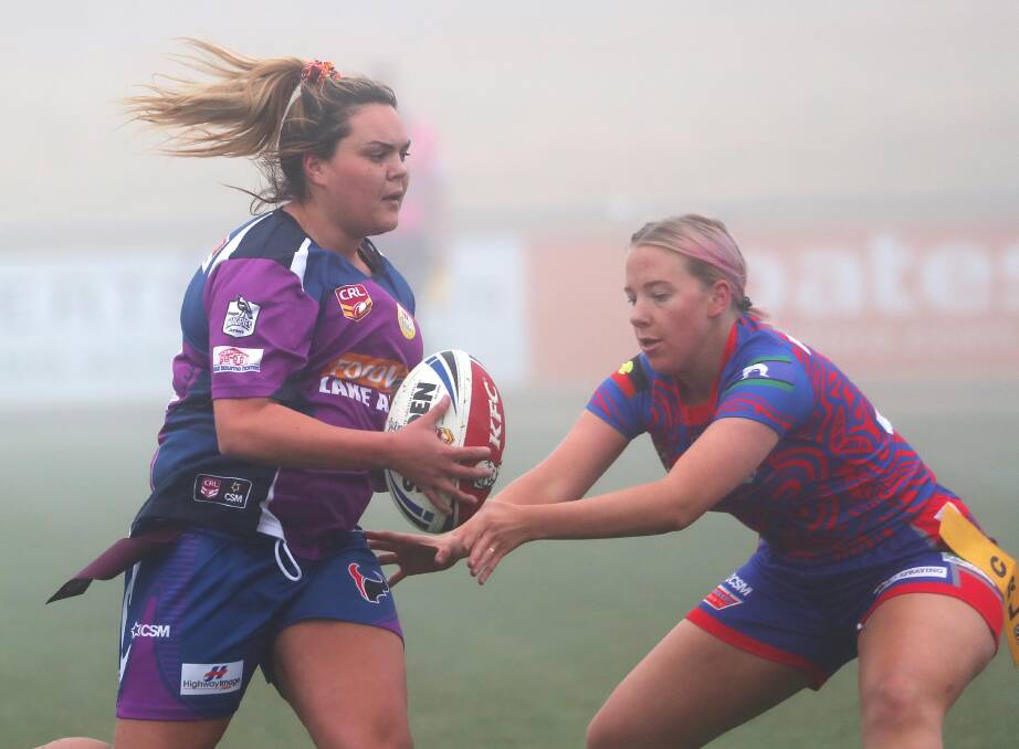 ON THE MOVE: Matiese Fazier tries to make a tag on Montana Kearnes during Southcity's 18-0 win over Kangaroos at a foggy Equex Centre on Saturday. Picture: Emma Hillier