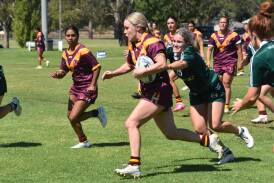 Sophie Gaynor tries to make a break during Riverina's heavy loss to Western to start the women's Country Championships at Laurie Daley Oval on Sunday. Picture by Courtney Rees