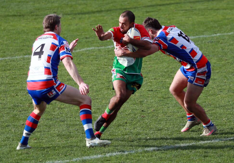 Harold Kirby tries to break out of the Young defence on Sunday.