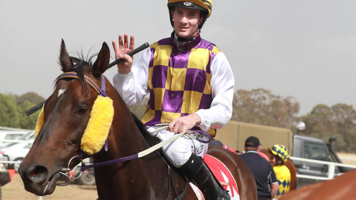 BIG HAUL: Apprentice jockey Tyler Schiller makes it four wins for the day after winning the Tumbarumba Cup with Southern Gamble on Saturday. Pictures: Les Smith