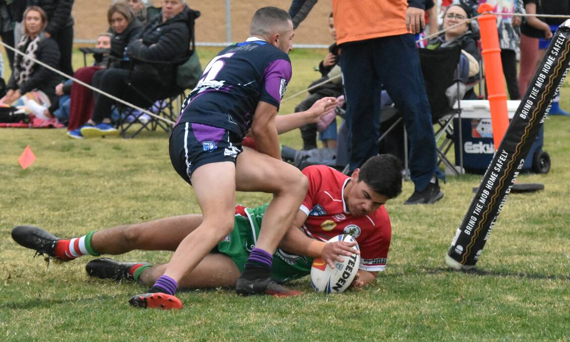 IT'S TRY TIME: Jesse Fitzhenry can't stop James Morgan from scoring as Brothers ensured Southcity started their season with a 38-30 loss at Harris Park on Saturday: Picture: Courtney Rees