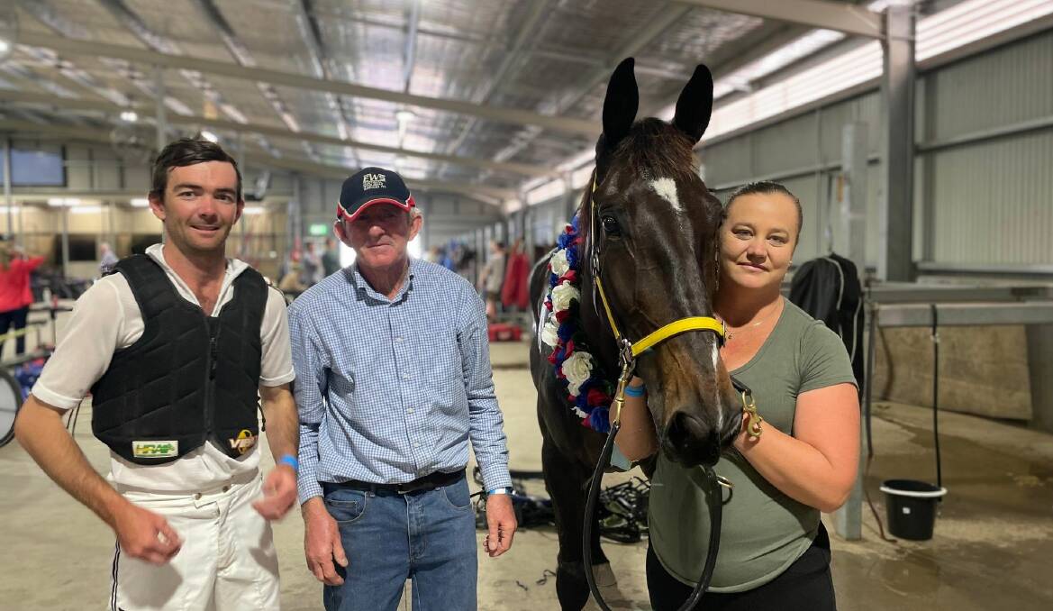 Peter McRae, Trevor White and Sally Dean celebrate Defiant's win in the NSW Breeders Challenge Western Region Final at Bathurst on Wednesday. Picture: Amy Rees