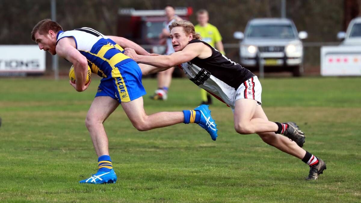 RETURN NEARING: Lachie Kendall looks to shrug off Bailey Clark in Mangoplah-Cookardinia United-Eastlakes trial win over North Wagga on Saturday. Picture: Les Smith