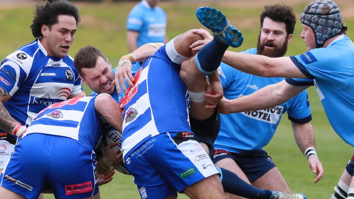 SWAMPED: Waratahs forward Richie Lamont gets driven to the ground by the Wagga City defence in his side's loss at Conolly Rugby Complex on Saturday. Picture: Les Smith