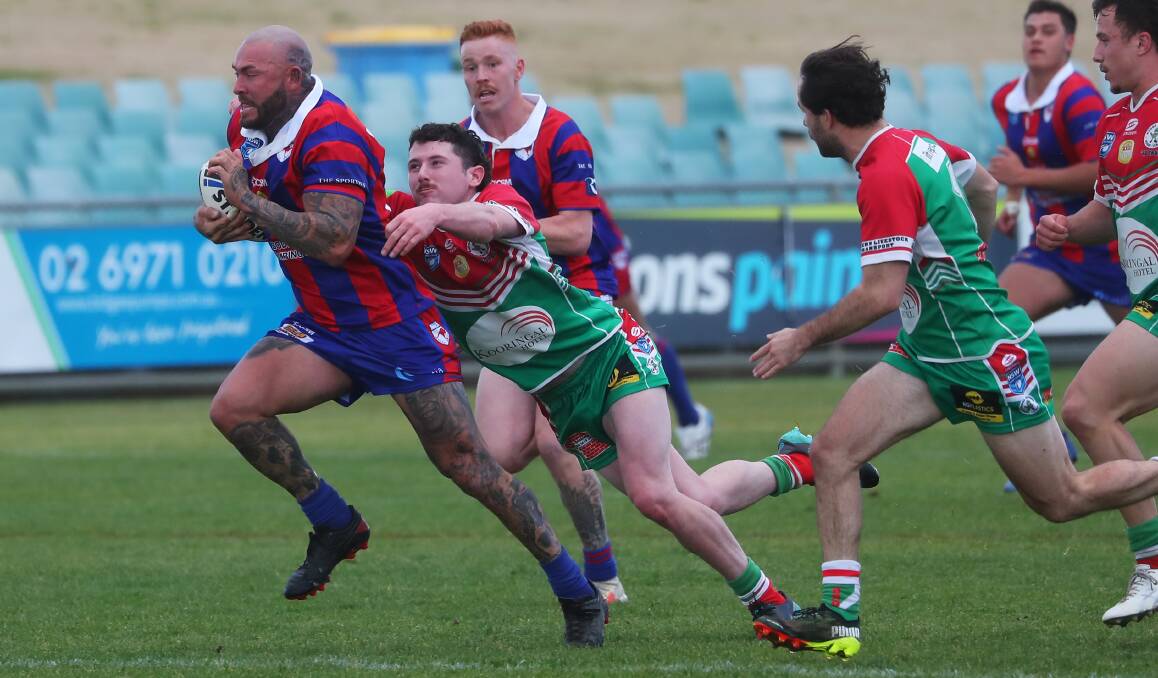 ON THE BURST: Kangaroos forward Chris Maher tries to break out of Sam Macklan's tackle attempt in the win over Brothers at Equex Centre on Saturday. Picture: Emma Hillier