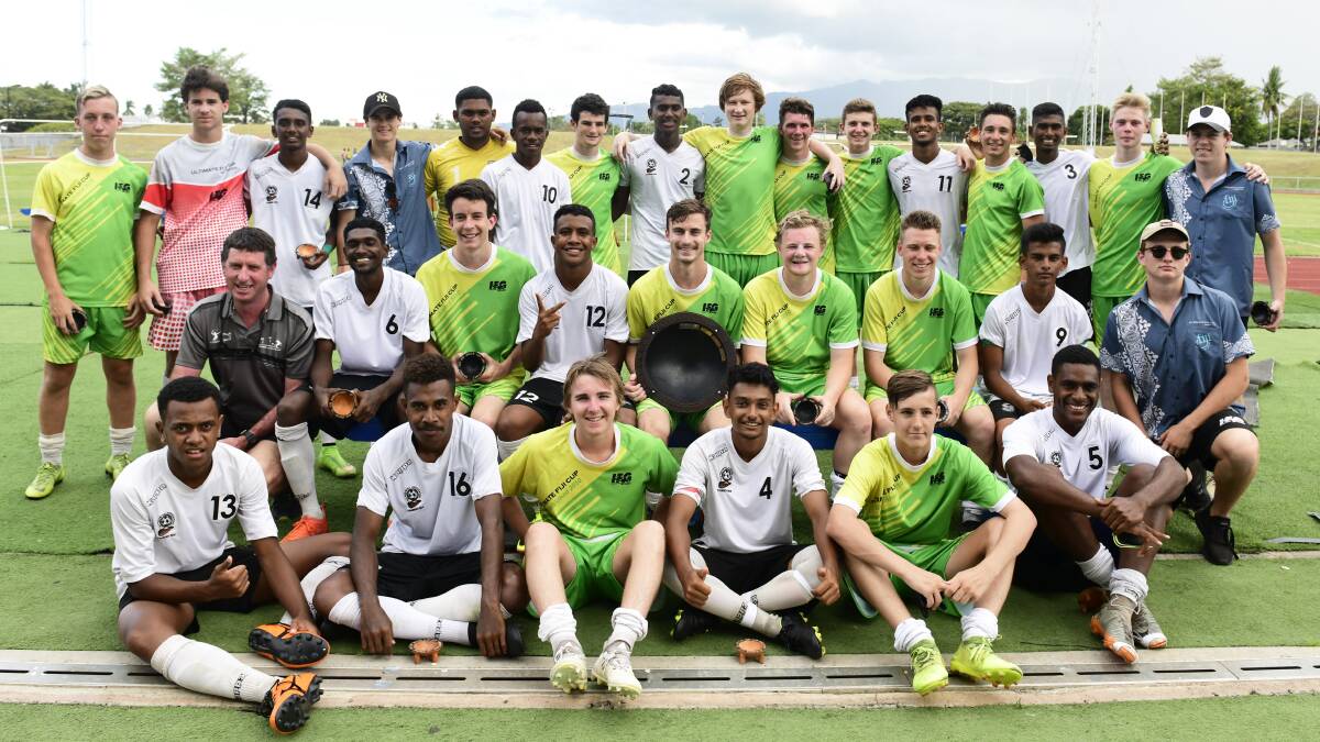 COMING TOGETHER: Rivals celebrate after the Ultimate Fiji Soccer Cup.