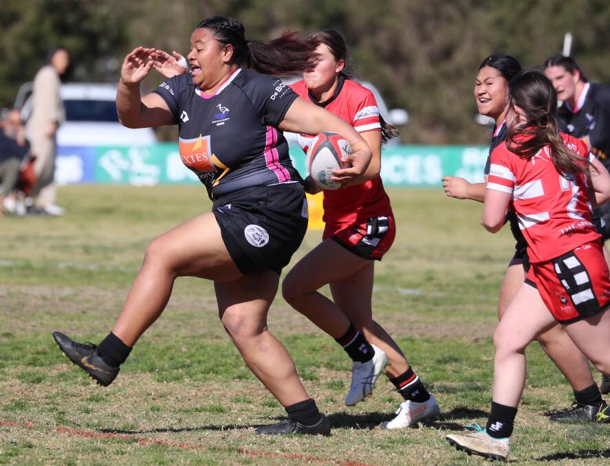 BREAKING FREE: Angelina Lemoto busts through the CSU defence as Griffith scored 20 unanswered points in the second half to book their grand final berth.