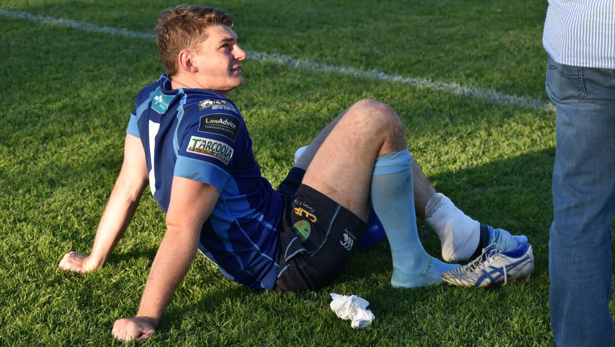 ON ICE: Waratahs flanker Sam Bunny receives treatment after rolling his ankle in the 85-5 win over CSU at Beres Ellwood Oval on Saturday. Picture: Courtney Rees