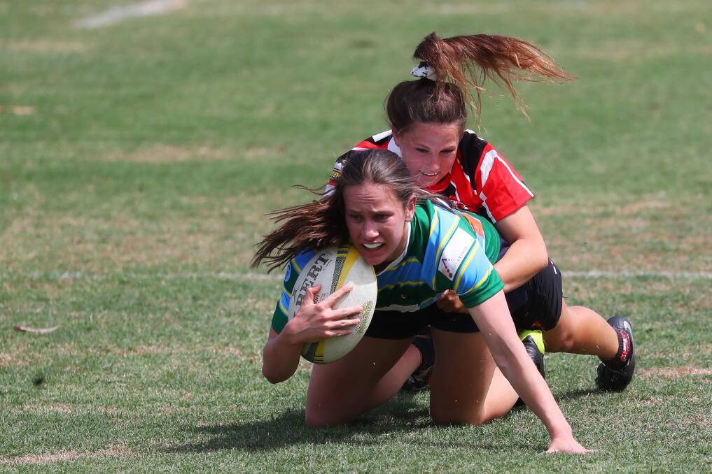 GOT YA: Southern Inland's Holly Stephens brings down former CSU player Claudia Obst in the win over Uni-Norths at Conolly Rugby Complex. Picture: Emma Hillier