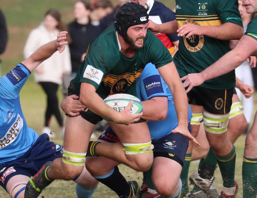 COMING DOWN: Ag College's Ben Brooke gets caught by the Waratahs defence as his side lost top spot to their crosstown rivals at Beres Ellwood Oval on Saturday. Picture: Les Smith