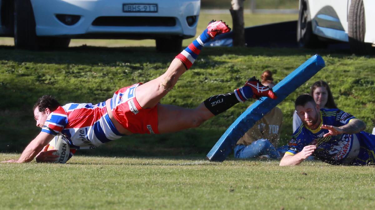 TRY TIME: Daniel Foley can't stop John Grant from scoring in Young's come-from-behind win over Junee on Sunday. Picture: Les Smith