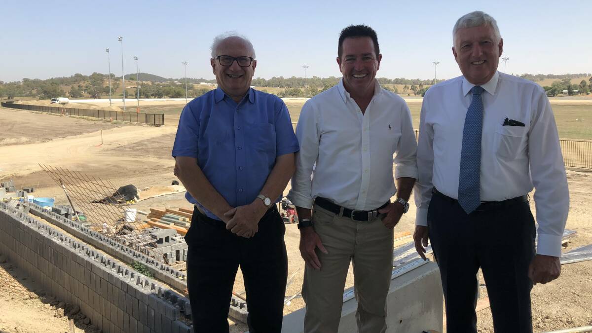 Wagga Harness Racing Club president Terry McMillan, racing minister Paul Toole and Harness Racing NSW chairman Rod Smith at the new track earlier this month.