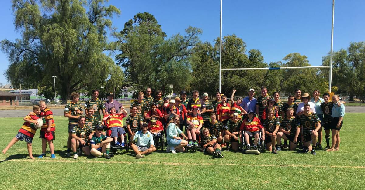 GALA DAY: Cootamundra and Ag College rugby players celebrate a gala day hosted by the Tricolours to raise money for the Angus Aims for Independence charity on Saturday. Photo: Susie Pennington