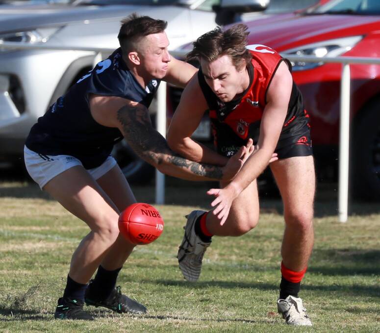 CONTEST: Coleambally's Theo Valeri and Hugh Templeton battle for the ball in Marrar's win at Langtry Oval on Saturday. Picture: Les Smith