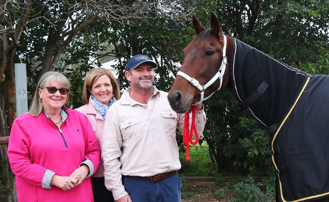 SHINING LIGHT: Co-owners Linda Inwood, Fiona Fitzgerarld and Darren Richardson, who also trains, line up Ultimate Risk in the Regional Championships final at Riverina Paceway on Friday. Picture: Emma Hillier