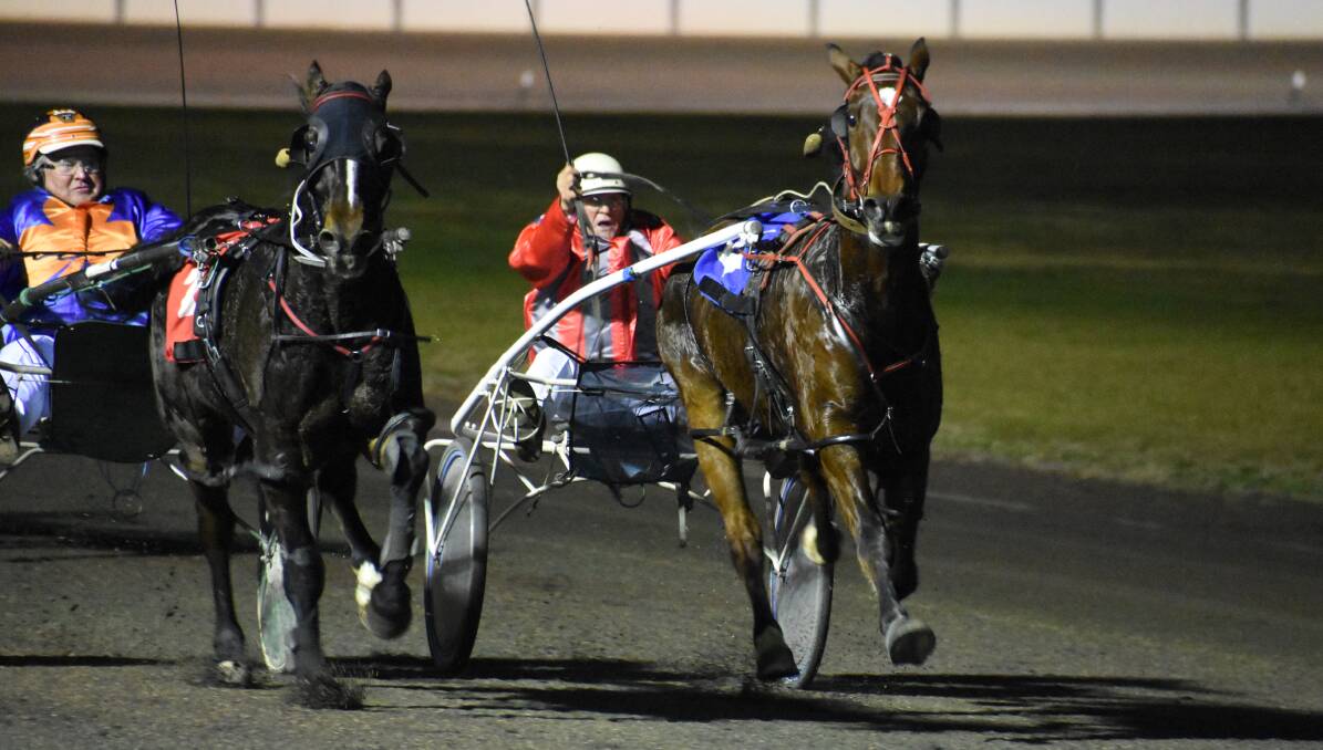 BREAKTHROUGH: A Good Ideal runs past Sunofasis to win his first race in 53 starts for Ganmain trainer-driver Ray Turner at Young on Tuesday. Picture: Peter Guthrie