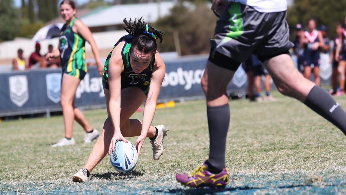 TRY TIME: Hayley Wade scoring during Wagga's big win in the under 18s girls final on Sunday.