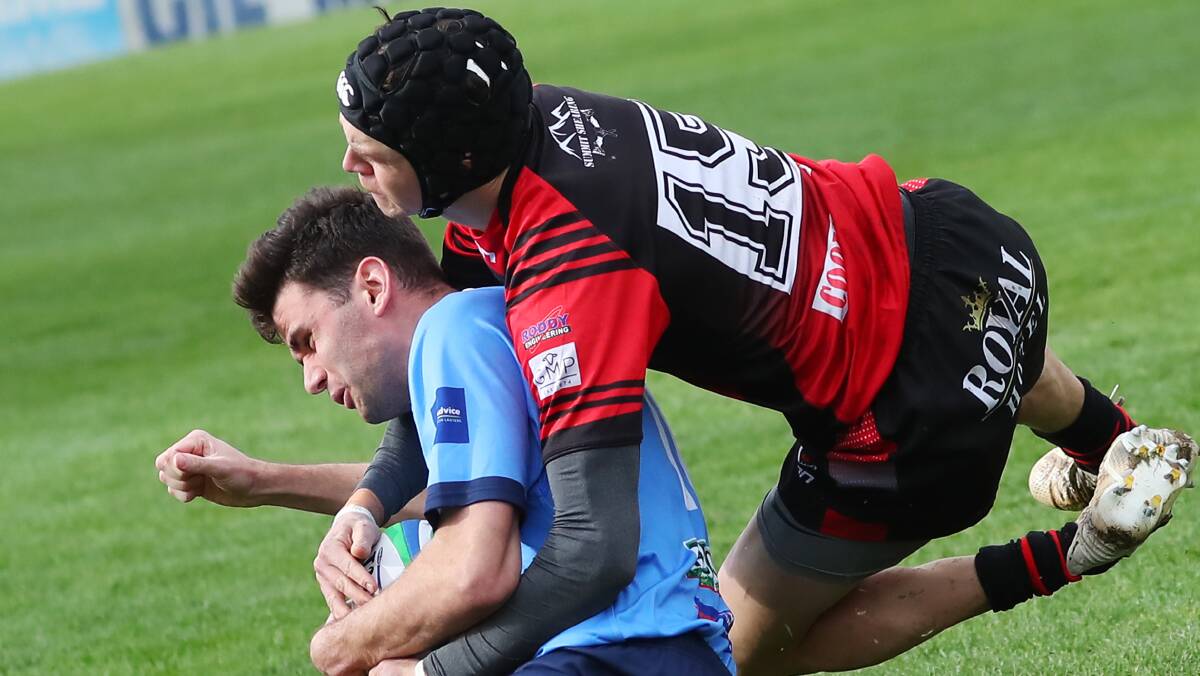 GOOD START: Richie Lamont gets brought down by Mitch Ivill as Waratahs scored their third win over Tumut in five games so far this season. Picture: Emma Hillier