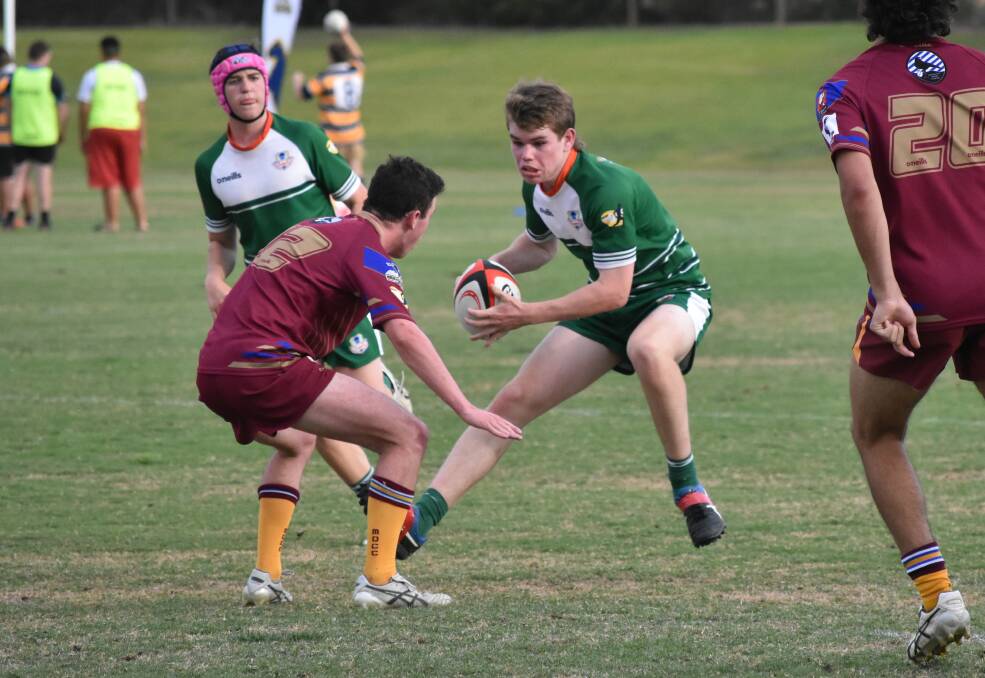 IN MOTION: Tom Fitzgerald looks to step past Will Hurst as The Riverina Anglican College extended their unbeaten run in the Super Sixes at Conolly Rugby Complex on Thursday. Picture: Courtney Rees