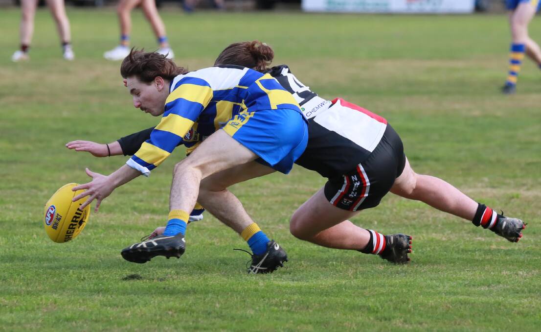 HARD AT IT: Mitch Bloomfield and Zac Delaney battle for the ball during an impressive Mangoplah-Cookardinia Uited-Eastlakes trial win against North Wagga on Saturday. Picture: Les Smith