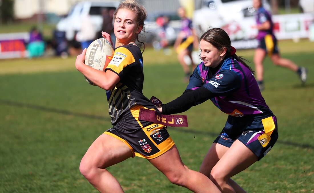CLOSE CALL: Holly Stephens tries to stop Danielle Hand from making a break in Southcity's 8-6 loss to Gundagai at Harris Park on Sunday. Picture: Emma Hillier