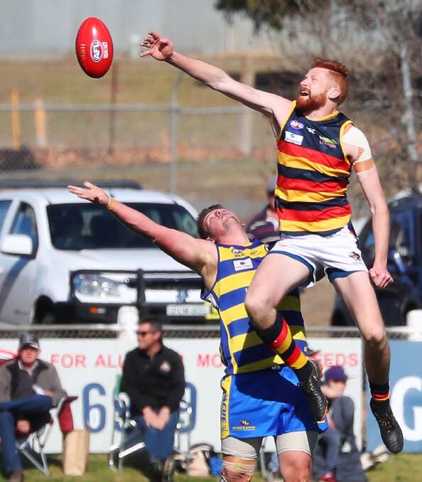 Leeton-Whitton ruckman Mason Dryburgh launches up over Andrew Dickins on Sunday.