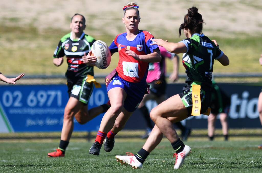 COMING THROUGH: Jessica Beer looks to make inroads against Albury as Kangaroos kept their season alive with a tight win at Equex Centre on Saturday. They face Temora in the preliminary final after they suffered their first loss.