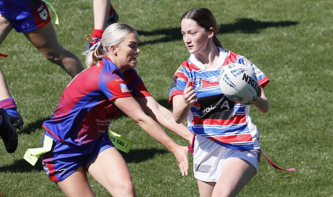 ALL SQUARE: Jessica Beer tries to stop Jessica McInerney in the drawn clash between Kangaroos and Young on Sunday. Picture: Les Smith