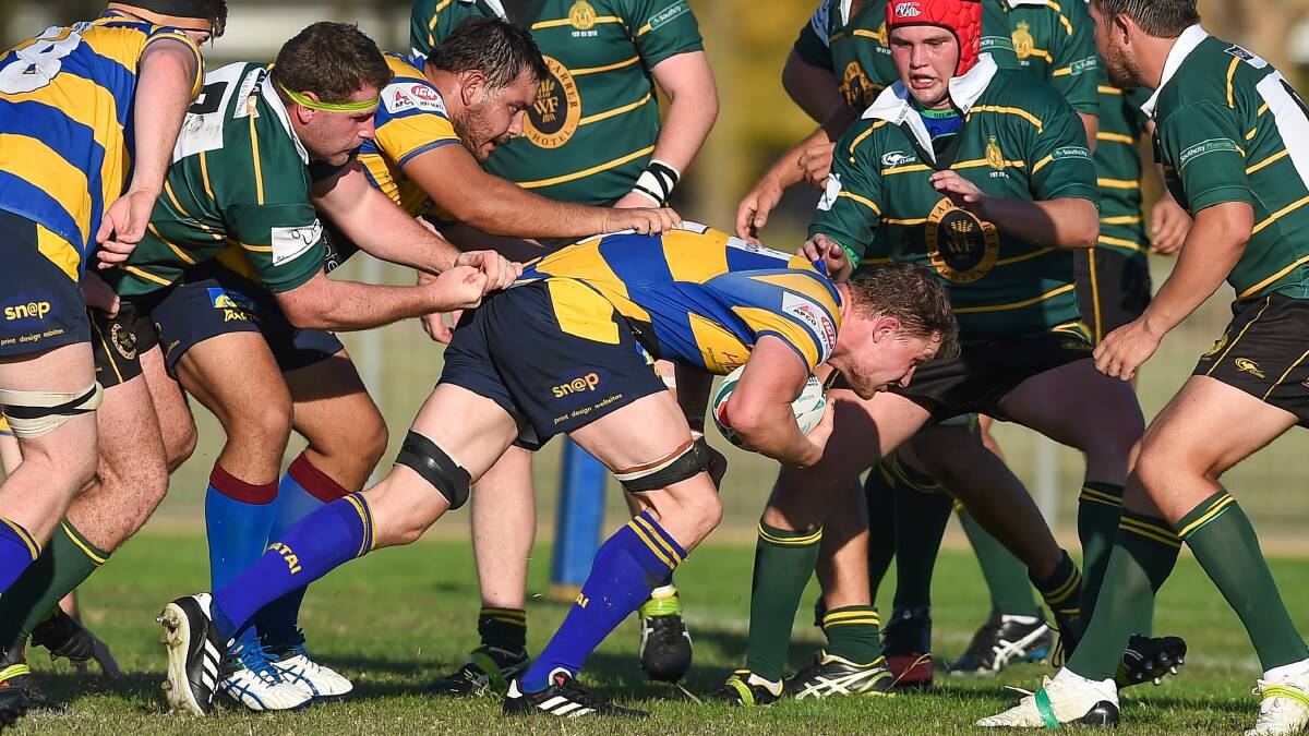 GET LOW: Dave Cooper-Dunn burrows his way into the Ag College defence during Albury's narrow win on Saturday. Picture: The Border Mail