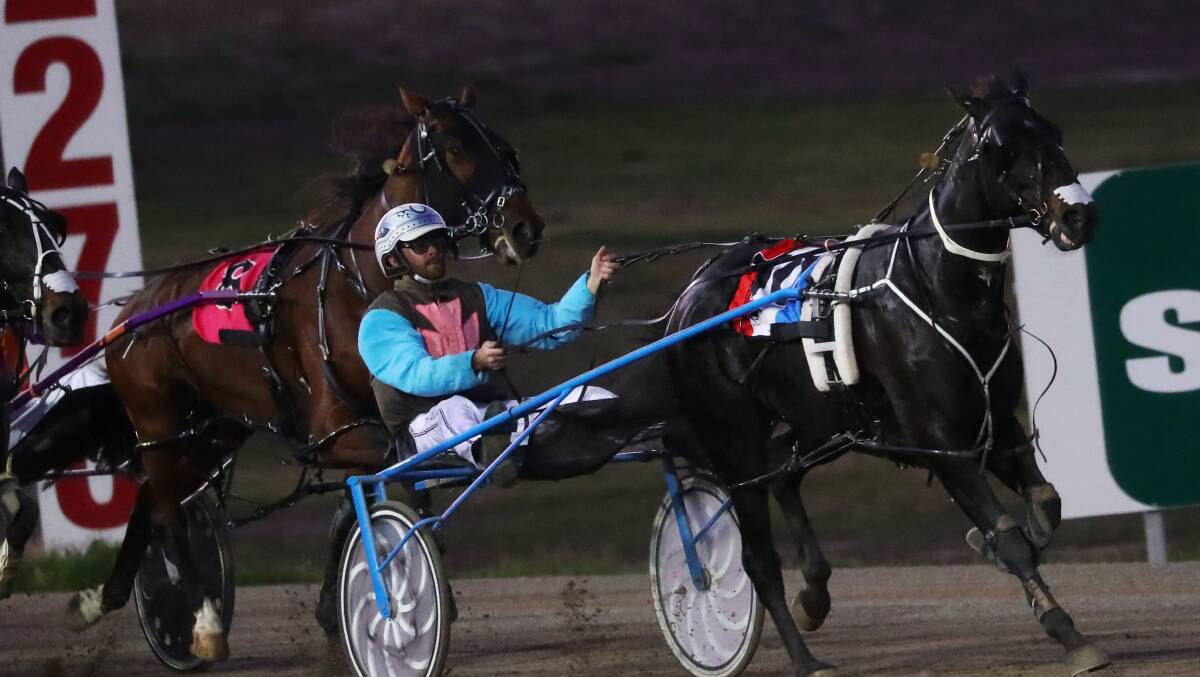 RUNNING AWAY: Peter McRae and Nobbys Clock taking out the opening race at Riverina Paceway on Monday. Picture: Emma Hillier