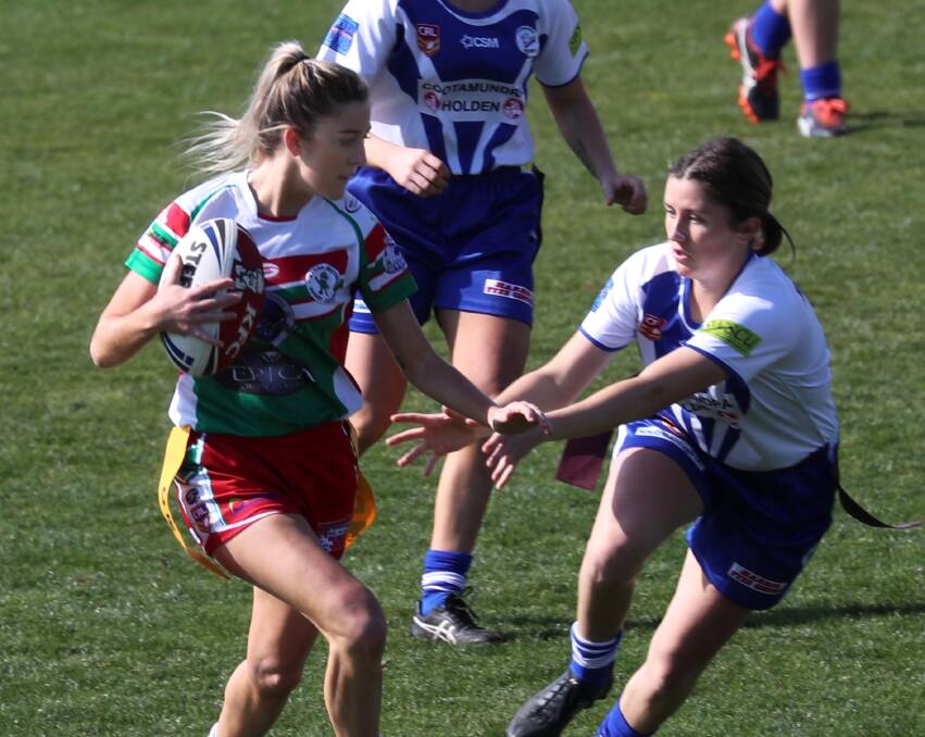 ONE WIN AWAY: Cootamudra's Lauren Connell tries to make a tag on Tarni Price during Brothers big leaguetag win in the preliminary final on Sunday. Picture: Les Smith