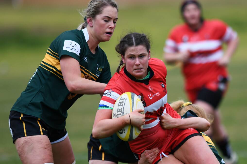 GOING DOWN: Ivy Merhelan gets brought down by the Ag College defence in CSU's 30-5 win at Beres Ellwood Oval on Saturday.